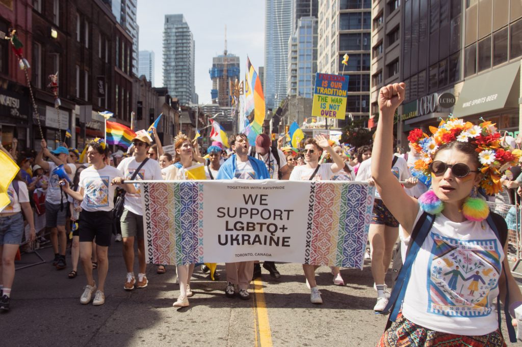 	We Support LGBTQ+ Ukraine community group marching in the 2023 Toronto Pride Parade. Photo by Fynn Badgley.